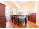 Formal dining room boasts hardwood floors and elegant chandelier lighting at 6081 Boulder Ct, Columbus, IN 47201