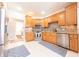 Well-appointed kitchen with wooden cabinets, stainless steel appliances, and tiled backsplash at 6081 Boulder Ct, Columbus, IN 47201