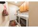 Convenient laundry room with full-sized washer, dryer, cabinet storage and natural lighting at 6081 Boulder Ct, Columbus, IN 47201