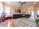 Spacious living room features a leather sectional, patterned rug, and bright, natural light at 6081 Boulder Ct, Columbus, IN 47201