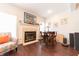 Cozy living room with a fireplace, hardwood floors, and a colorful armchair at 6081 Boulder Ct, Columbus, IN 47201