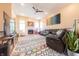 Comfortable living room with a fireplace, leather seating, and a large decorative rug at 6081 Boulder Ct, Columbus, IN 47201