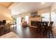 Bright living room featuring a fireplace, hardwood floors, and access to outdoor space at 6081 Boulder Ct, Columbus, IN 47201