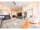 Open-concept living area with hardwood floors, a large TV, and views of the kitchen and dining areas at 6081 Boulder Ct, Columbus, IN 47201