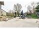 Large outdoor patio featuring seating, a fire pit, and landscaping at 6081 Boulder Ct, Columbus, IN 47201