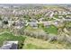 Extensive aerial view of a residential area with manicured lawns and verdant trees, providing a serene living environment at 621 Foxboro Dr, Avon, IN 46123
