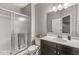 Clean bathroom features tiled floors, a glass-enclosed shower, modern vanity with countertop space, and neutral color palette at 621 Foxboro Dr, Avon, IN 46123