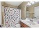 Bright bathroom features a shower with cartoon curtain and modern fixtures at 621 Foxboro Dr, Avon, IN 46123