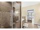 Elegant bathroom featuring a glass shower, soaking tub, and access to the spacious primary bedroom at 621 Foxboro Dr, Avon, IN 46123