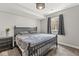 Relaxing bedroom with large window, plush carpet, black dresser, and blackout curtains for a calm and cozy ambiance at 621 Foxboro Dr, Avon, IN 46123
