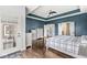 Spacious bedroom features a tray ceiling, hardwood floors, and a private entrance to the backyard at 621 Foxboro Dr, Avon, IN 46123