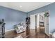 Comfortable bedroom with hardwood floors, and stylish accent furniture in a well lit room at 621 Foxboro Dr, Avon, IN 46123