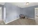 Neutral carpeted flex-space can function as additional bedroom at 621 Foxboro Dr, Avon, IN 46123