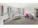 Inviting bedroom filled with natural light with multiple windows, a ceiling fan, and plush carpet is perfect for comfort at 621 Foxboro Dr, Avon, IN 46123