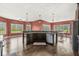 Spacious kitchen island featuring dark cabinetry, granite countertops, and a stainless steel dishwasher at 621 Foxboro Dr, Avon, IN 46123