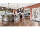 Modern kitchen with dark cabinets, granite countertops, stainless steel appliances, and hardwood floors at 621 Foxboro Dr, Avon, IN 46123