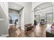 View of the living room from the foyer featuring hardwood floors and an archway at 621 Foxboro Dr, Avon, IN 46123