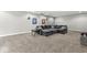 Relaxing living room featuring carpet floors, soft lighting, neutral walls, and cozy sectional is great for relaxation at 621 Foxboro Dr, Avon, IN 46123