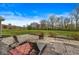 Outdoor patio featuring a fire pit, lounge seating, and a spacious backyard at 621 Foxboro Dr, Avon, IN 46123