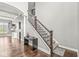 View of the staircase with decorative railing and a side table for decor at 621 Foxboro Dr, Avon, IN 46123