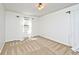 Light filled bedroom with neutral carpet, white walls and bright, natural light at 6454 Dean Rd, Indianapolis, IN 46220