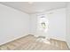 Cozy bedroom with neutral carpet, white walls and bright, natural light at 6454 Dean Rd, Indianapolis, IN 46220