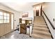 Entryway featuring stairs, stone floors, and a coat closet at 6454 Dean Rd, Indianapolis, IN 46220