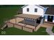 An elevated deck with a pergola, integrated planters, and stairs leading to the yard at 6454 Dean Rd, Indianapolis, IN 46220