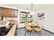 Eat-in kitchen with a skylight, custom cabinets, and a table with seating for four at 6454 Dean Rd, Indianapolis, IN 46220