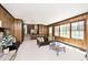 Inviting living room with stone fireplace, stylish seating, and natural light at 6454 Dean Rd, Indianapolis, IN 46220