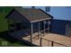 Screened porch with wood decking and a dark roof, offering a sheltered outdoor living space at 6454 Dean Rd, Indianapolis, IN 46220