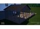 Angled perspective of a dark screened porch with railings and decking at 6454 Dean Rd, Indianapolis, IN 46220