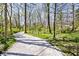 Crushed gravel walking path leading to home through wooded area at 6454 Dean Rd, Indianapolis, IN 46220