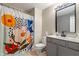 Bathroom featuring modern vanity, neutral walls, and colorful floral shower curtain at 6516 Emerald Hill Ct # 310, Indianapolis, IN 46237