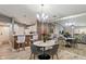 Open dining area offers modern lighting, and a mirrored wall enhancing the space's ambiance at 6516 Emerald Hill Ct # 310, Indianapolis, IN 46237
