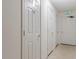 Hallway showing multiple doors with unit numbers and an exit sign at 6516 Emerald Hill Ct # 310, Indianapolis, IN 46237
