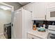 Bright kitchen featuring stainless steel appliances, a side-by-side refrigerator and black subway tile backsplash at 6516 Emerald Hill Ct # 310, Indianapolis, IN 46237
