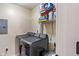Functional laundry area with new black washer and dryer, and storage space for detergents and supplies at 6516 Emerald Hill Ct # 310, Indianapolis, IN 46237