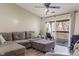 Comfortable living room with sliding glass doors to the balcony provides a cozy retreat at 6516 Emerald Hill Ct # 310, Indianapolis, IN 46237