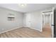 Bedroom displaying gray walls, laminate flooring, one window, and a closet in a calming space at 652 E Tilden Dr, Brownsburg, IN 46112