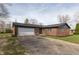 Charming brick home featuring an attached garage and well-maintained front yard at 652 E Tilden Dr, Brownsburg, IN 46112