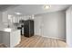 Eat-in kitchen features white cabinetry, stainless steel appliances, and plenty of counter space at 652 E Tilden Dr, Brownsburg, IN 46112