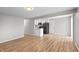 Efficient kitchen with white cabinetry, stainless steel appliances, and open floor plan at 652 E Tilden Dr, Brownsburg, IN 46112