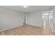 Open-plan living room showing laminate flooring, gray walls, and open doorways to other rooms at 652 E Tilden Dr, Brownsburg, IN 46112