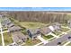 An aerial view of a suburban neighborhood showcasing tree-lined streets and well-maintained lawns at 6622 Cardiff Cir, McCordsville, IN 46055