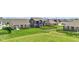 Expansive backyard view showcasing neighboring homes, fencing, and ample green space at 6622 Cardiff Cir, McCordsville, IN 46055
