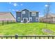 Backyard showing a lawn with a patio area and outdoor seating, perfect for relaxation and entertaining at 6622 Cardiff Cir, McCordsville, IN 46055