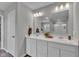 Bright bathroom featuring a double vanity, a large mirror, and modern fixtures at 6622 Cardiff Cir, McCordsville, IN 46055