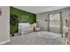 Stylishly designed Bedroom featuring an accent wall and classic white crib on top of plush carpet at 6622 Cardiff Cir, McCordsville, IN 46055
