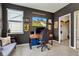 Charming bedroom featuring dark walls, neutral carpet, and gaming setup, creating a cozy, relaxing ambiance at 6622 Cardiff Cir, McCordsville, IN 46055